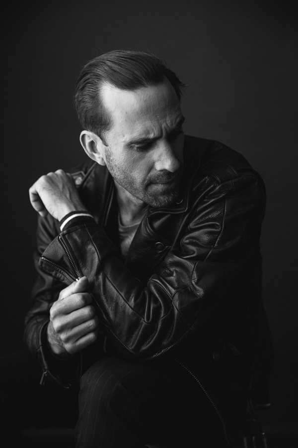 Photo of Actor Joseph Fiennes, from Handmaid's Tale photographed in studio in black and white. 